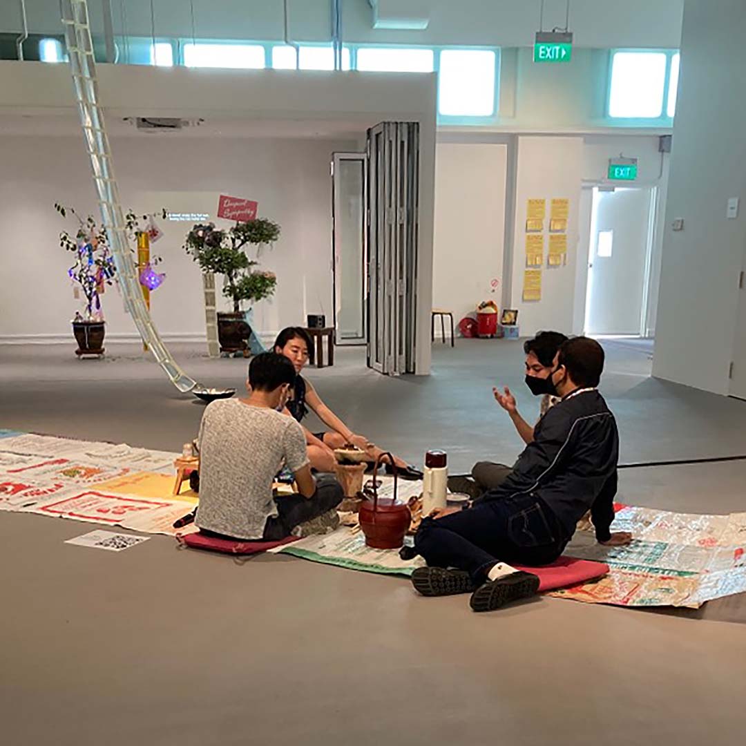 SAM curator Shabbir Hussain Mustafa with artists from the SAM Residences.